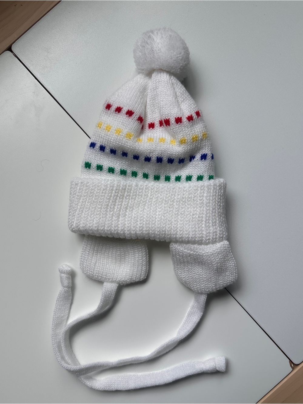 White Winter Baby Hat with Rainbow Details and Ear Flaps